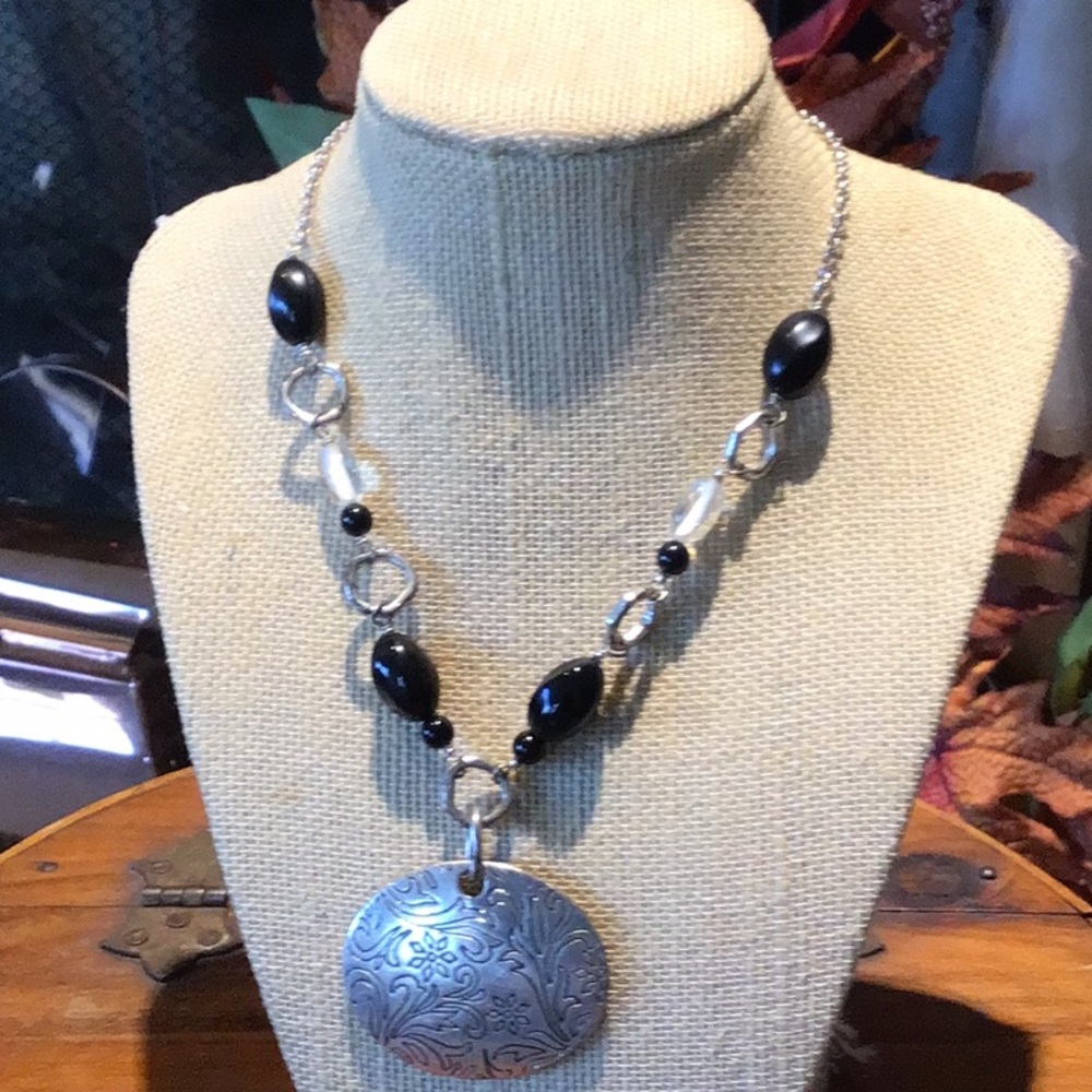 Silver necklace with beads and etched medallion